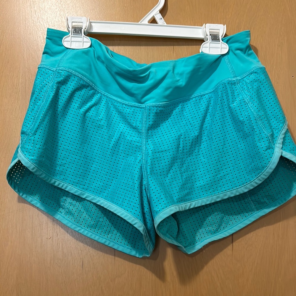 Lululemon shorts size 4 with a pocket in the back greenish blue color